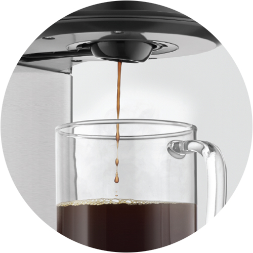 Coffee flowing from the product into a jug.
